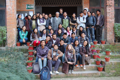 a group of people posing on stairs after completing a mapping workshop